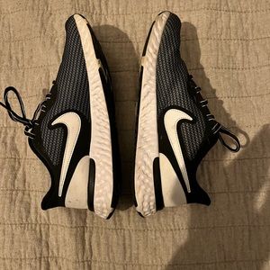 Nike Revolution Tennis Shoes. Used. Black and White. Women’s 8.5.